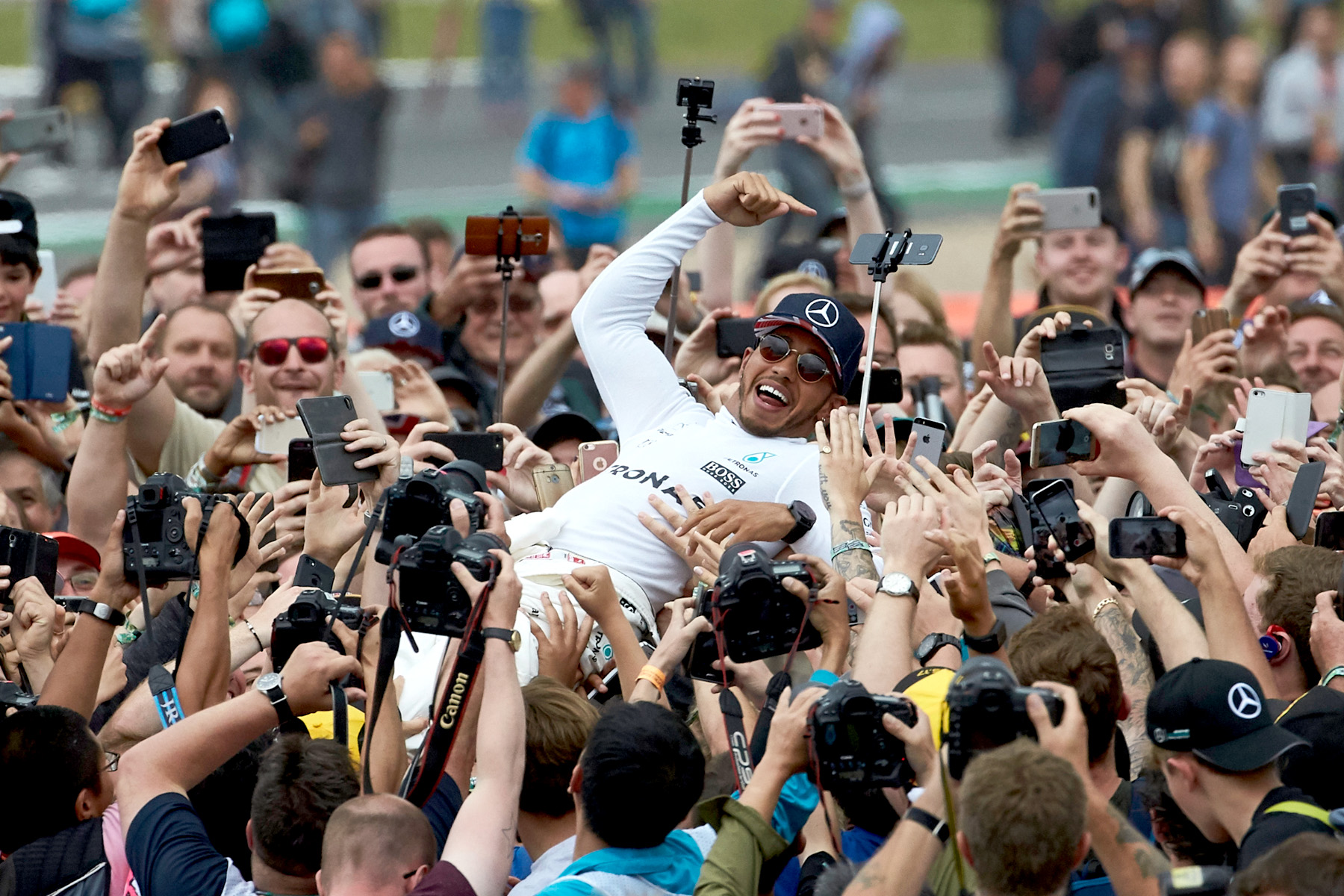 Lewis Hamilton surfs the crowd afeer winning the 2017 British Grand Prix.