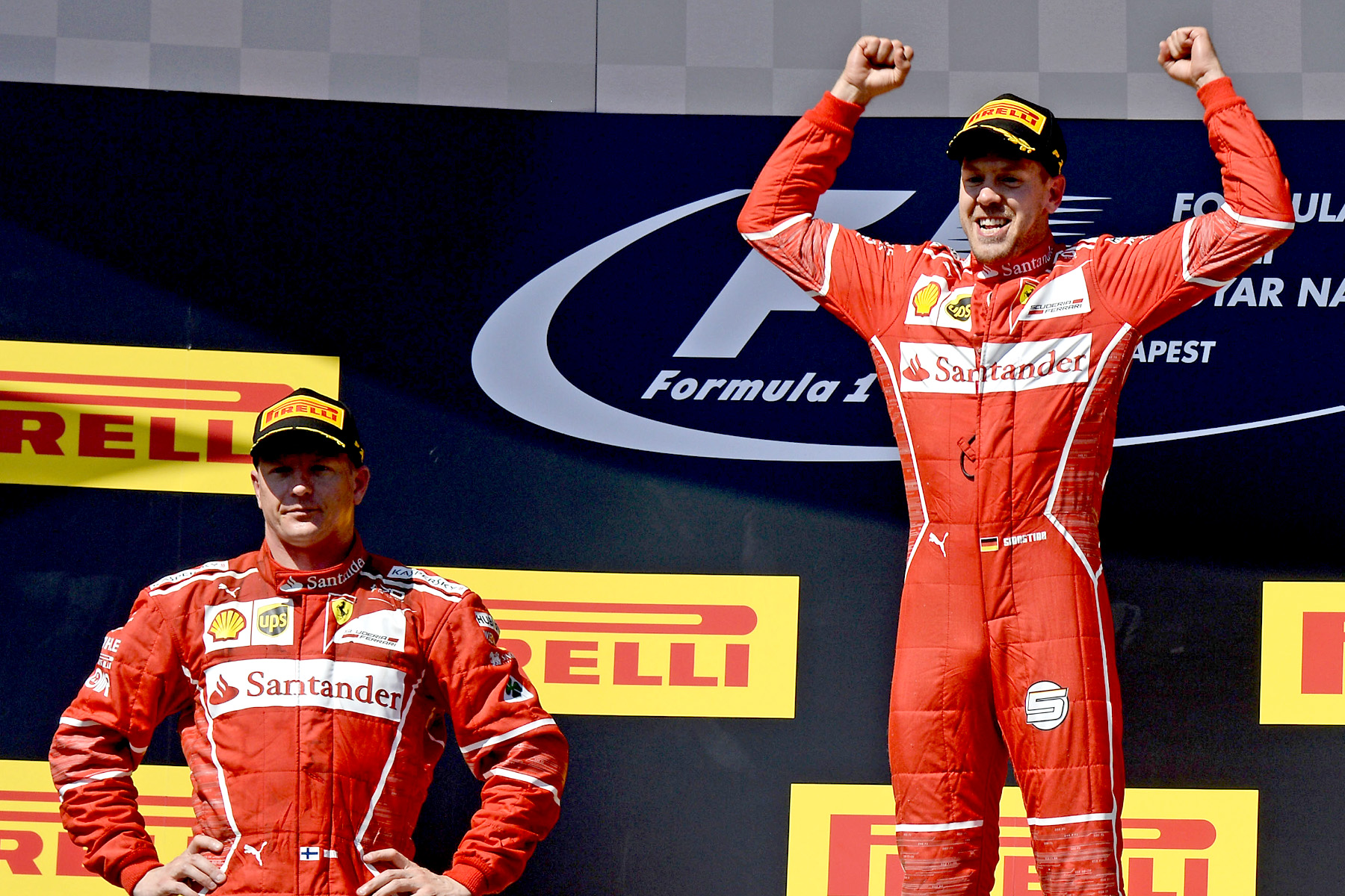 Sebastian Vettel and Kimi Raikkonen celebrate on the 2017 Hungarian Grand Prix podium.