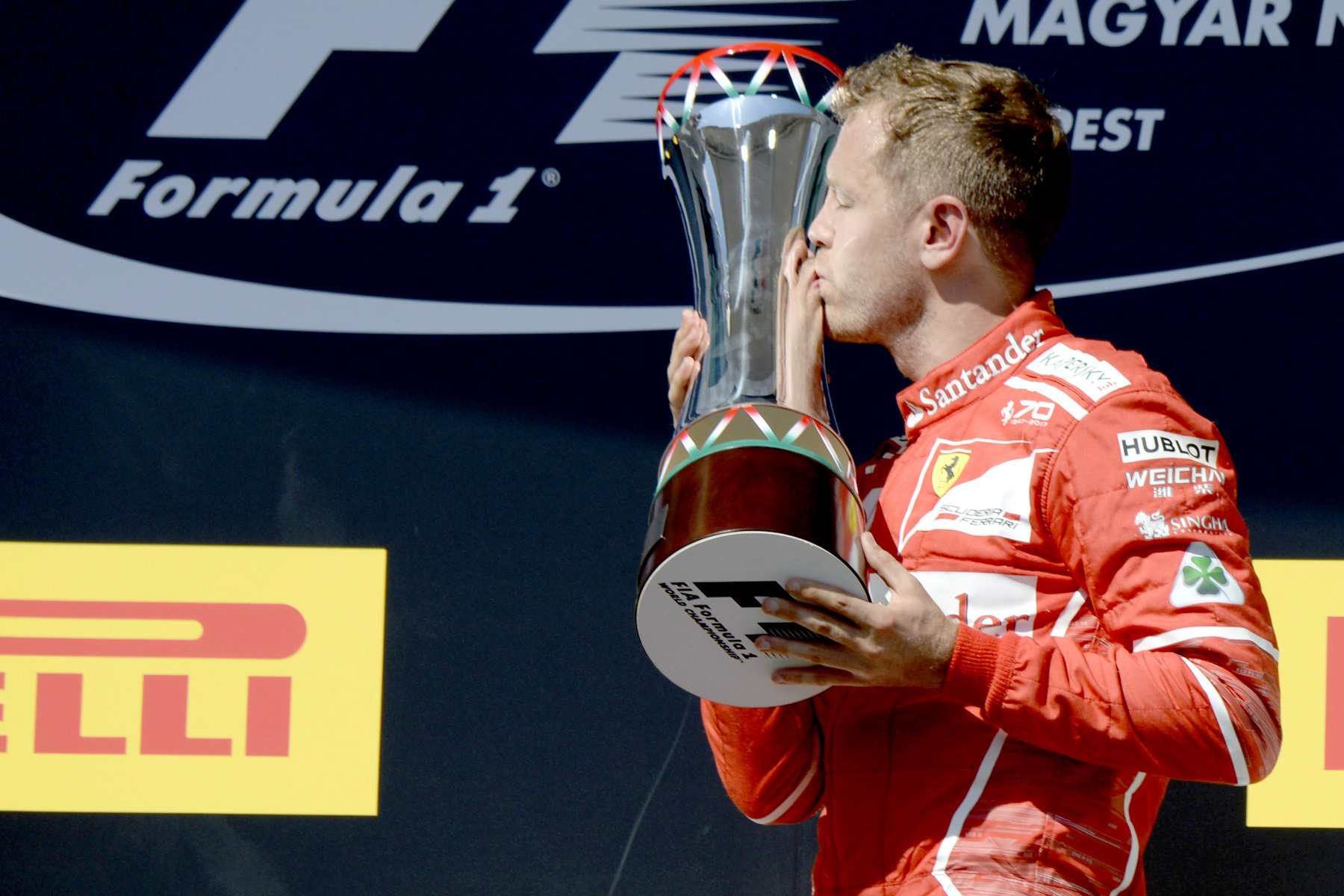 Sebastian Vettel celebrates his win on the podium at the 2017 Hungarian Grand Prix.