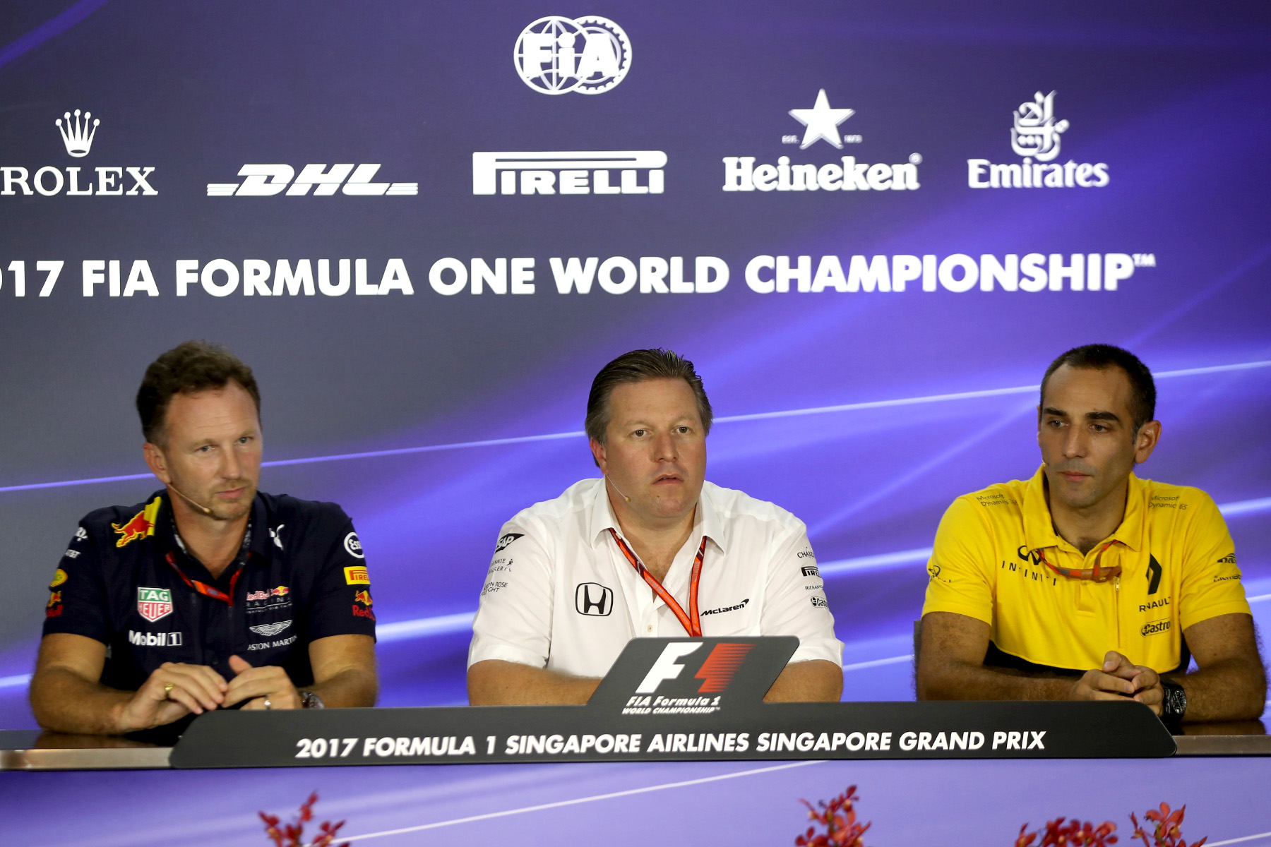 Red Bull Racing principal Christian Horner, McLaren executive director Zak Brown, and Renault Sport managing director Cyril Abiteboul at the 2017 Singapore Grand Prix.