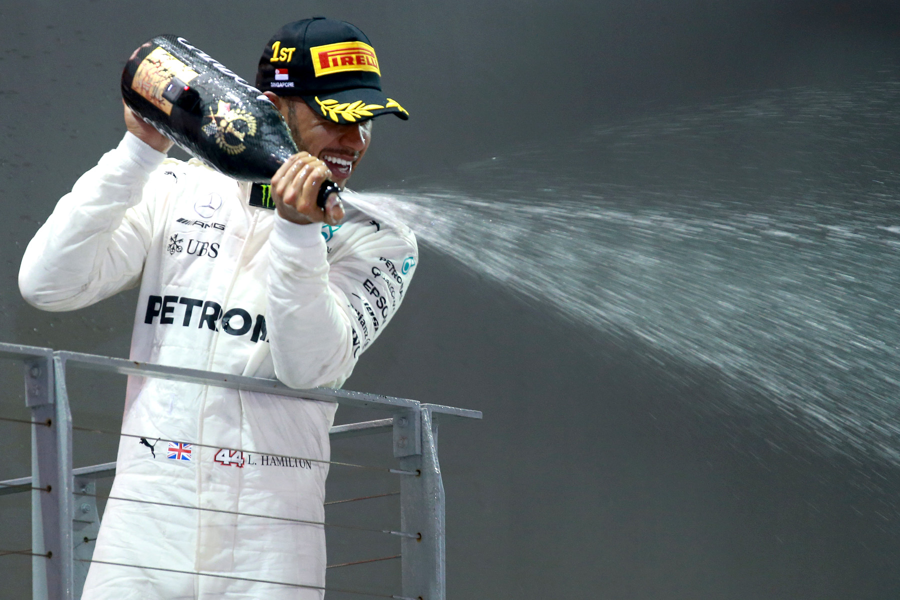 Lewis Hamilton celebrates on the 2017 Singapore Grand Prix podium.