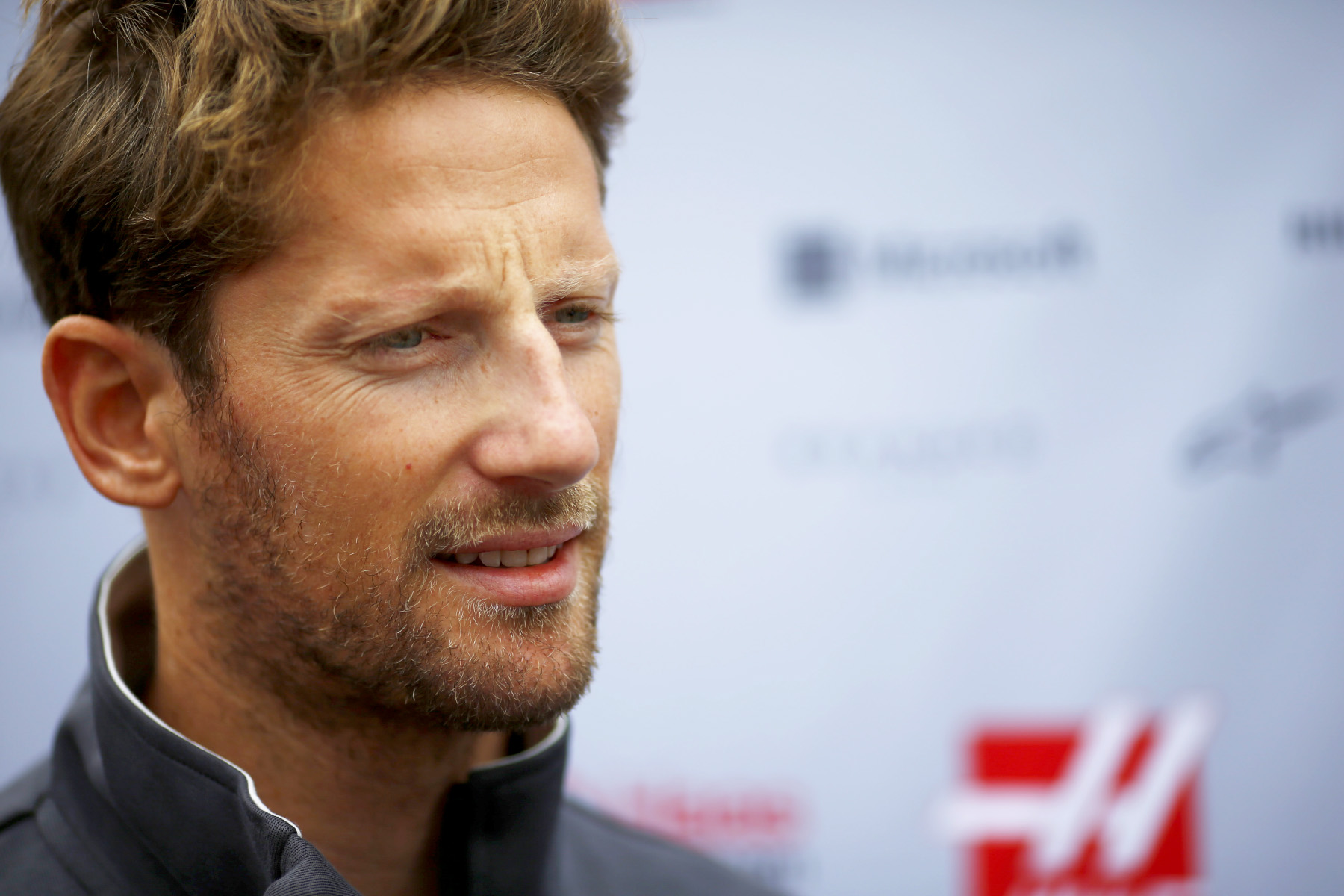 Romain Grosjean speaks to reporters at the 2017 Japanese Grand Prix.