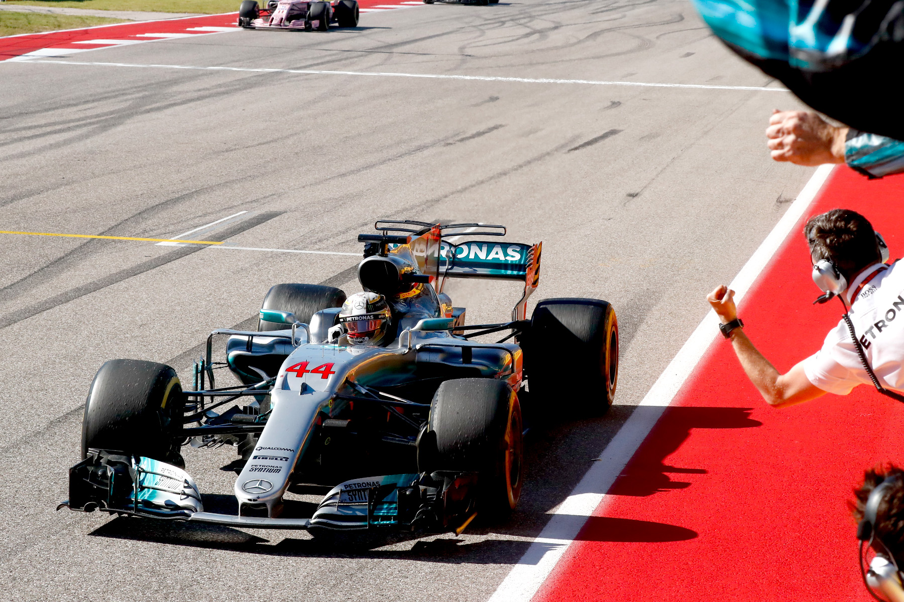 Lewis Hamilton takes the chequered flag at the 2017 united States Grand Prix.