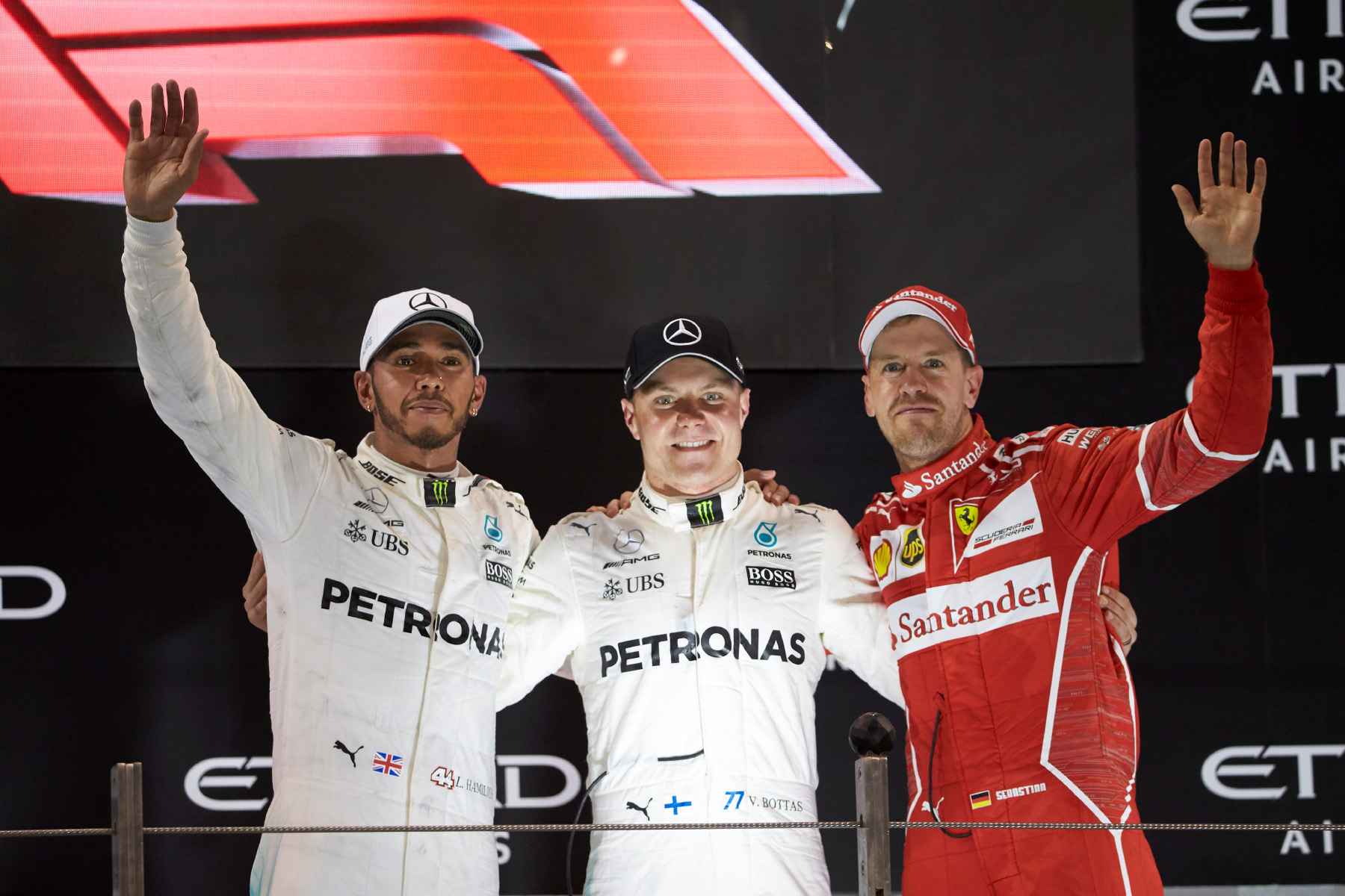 Valtteri Bottas, Lewis Hamilton and Sebastian Vettel celebrate on the 2017 Abu Dhabi Grand Prix podium.