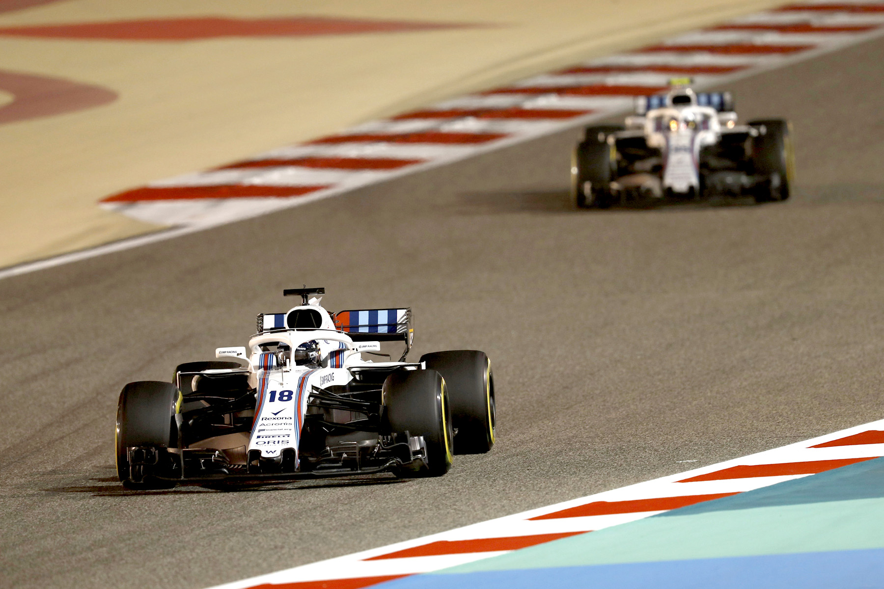 Lance Stroll and Sergey Sirotkin on track at the 2018 Bahrain Grand Prix.