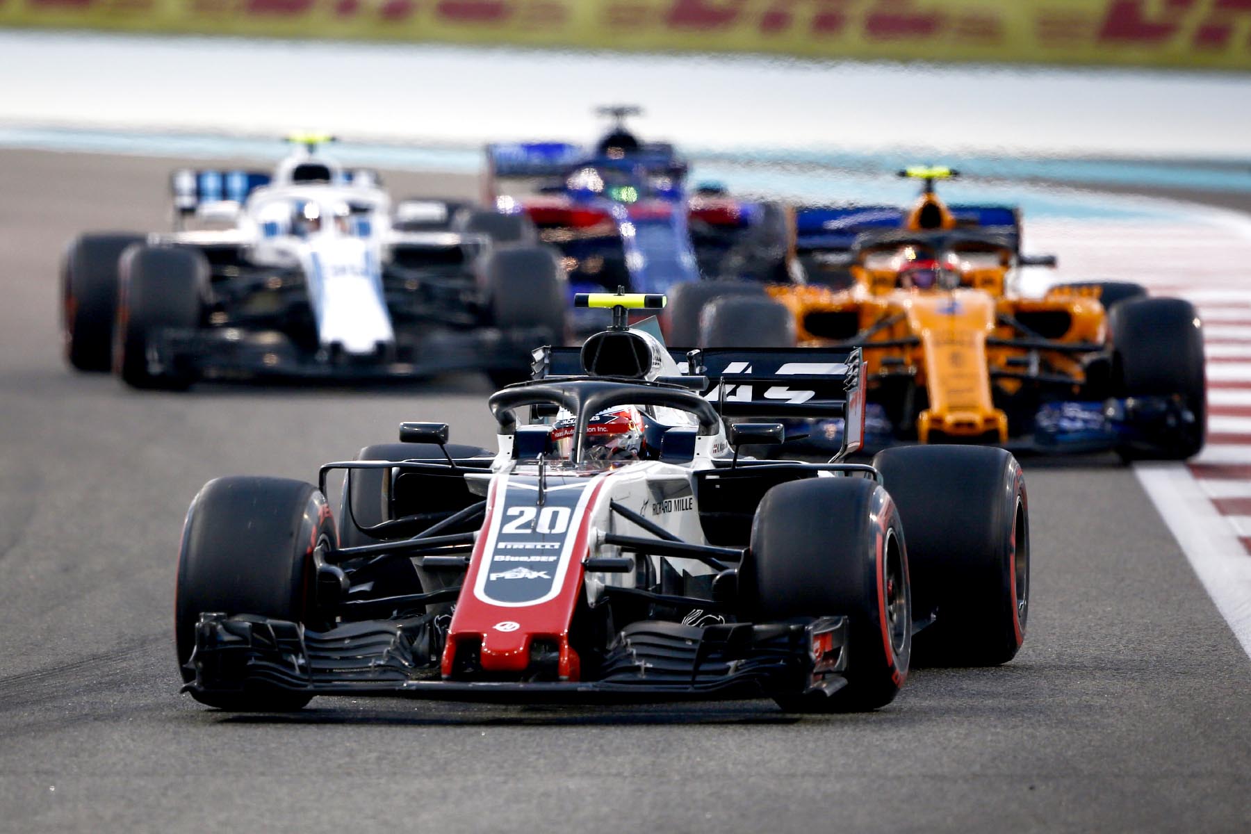 Kevin Magnussen leads a gaggle of midfield cars at the 2018 Abu Dhabi Grand Prix.