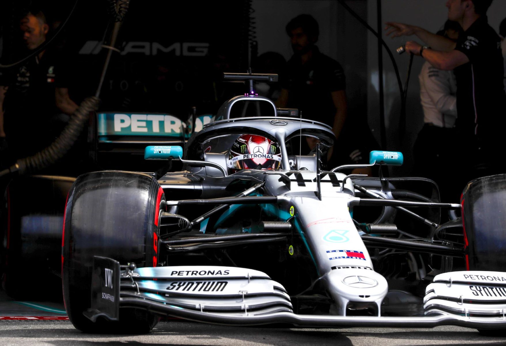 Lewis Hamilton drives out of his Mercedes garage.