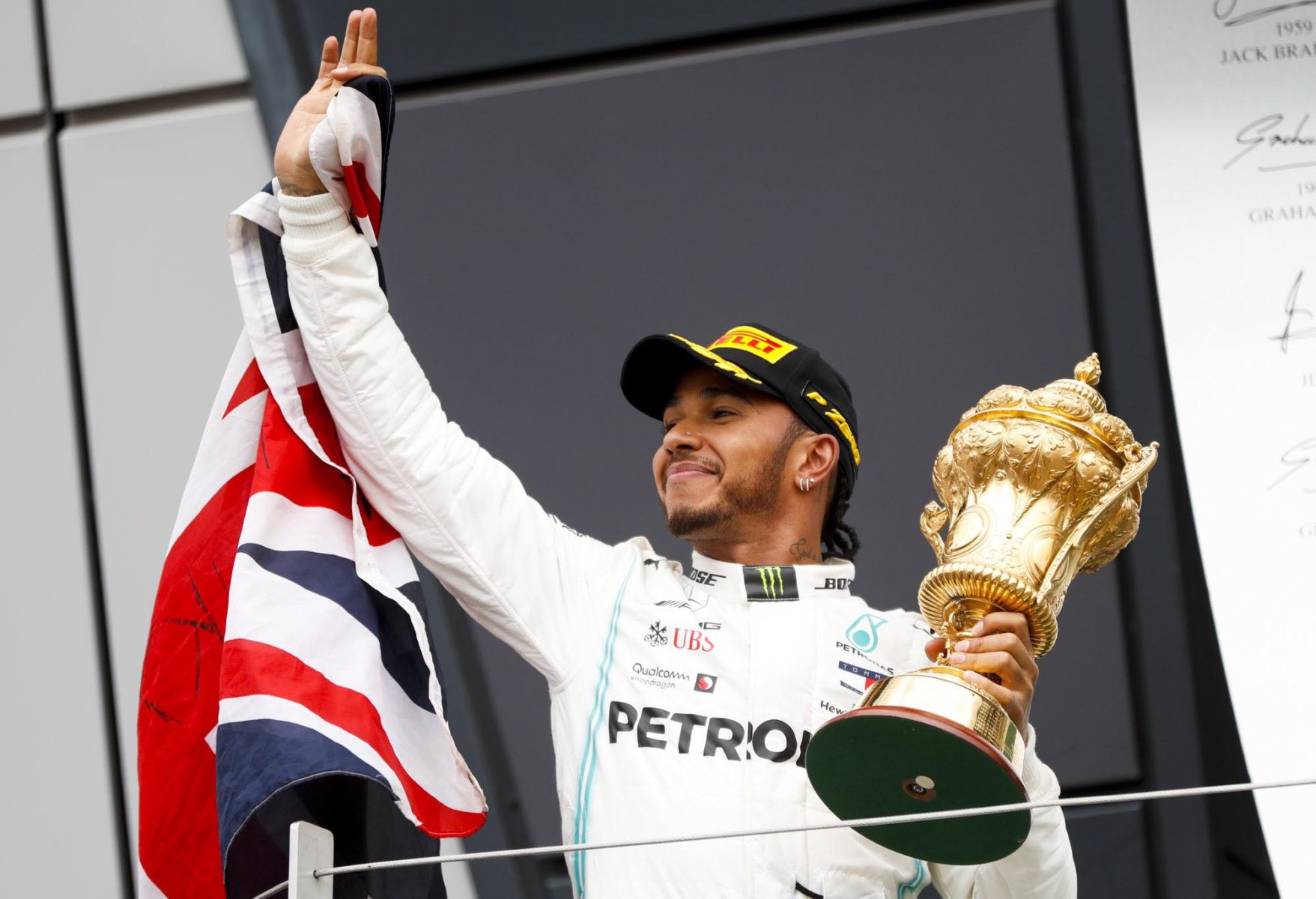 Lewis Hamilton celebrates with the British Grand Prix podium.