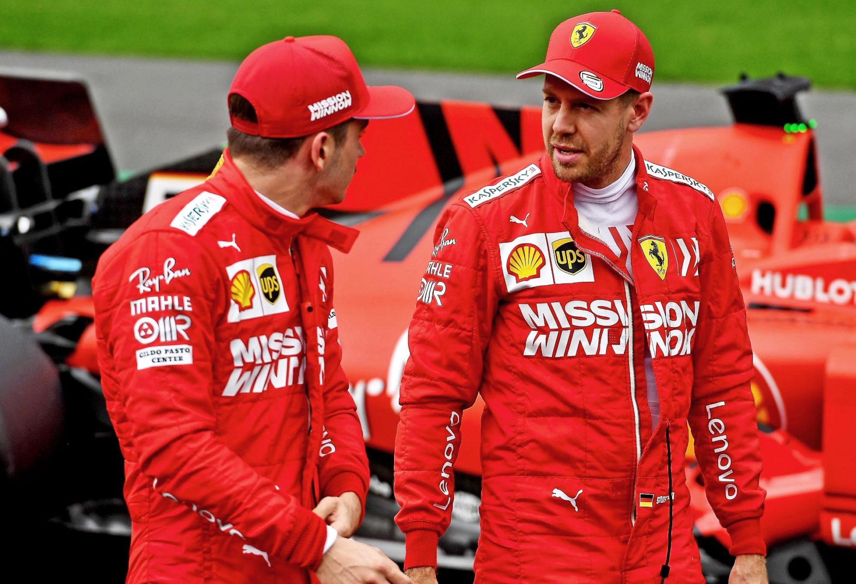 Charles Leclerc and Sebastian Vettel in conversation on the track after qualifying at the 2019 Mexican Grand Prix