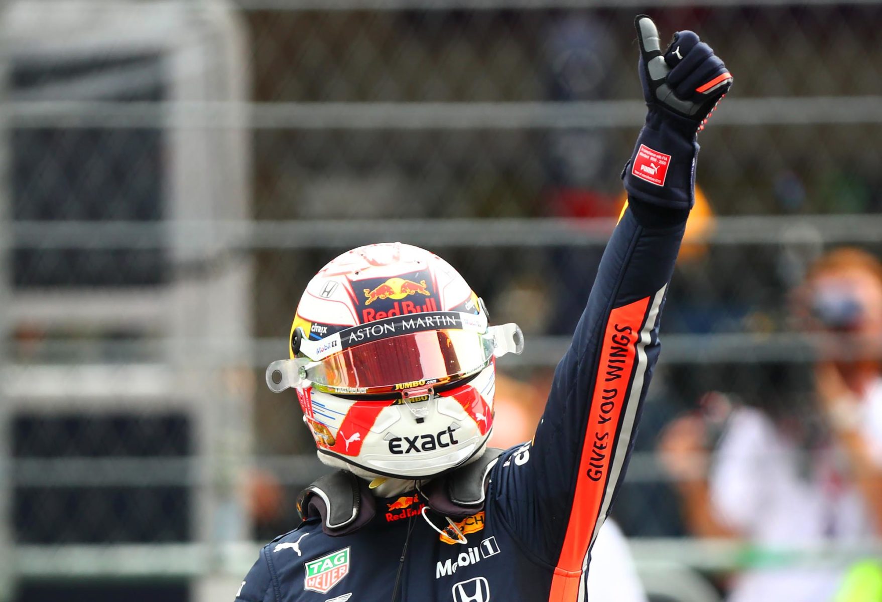Max Verstappen gives a thumbs up to the crowd after scoring pole at the 2019 Mexican Grand Prix