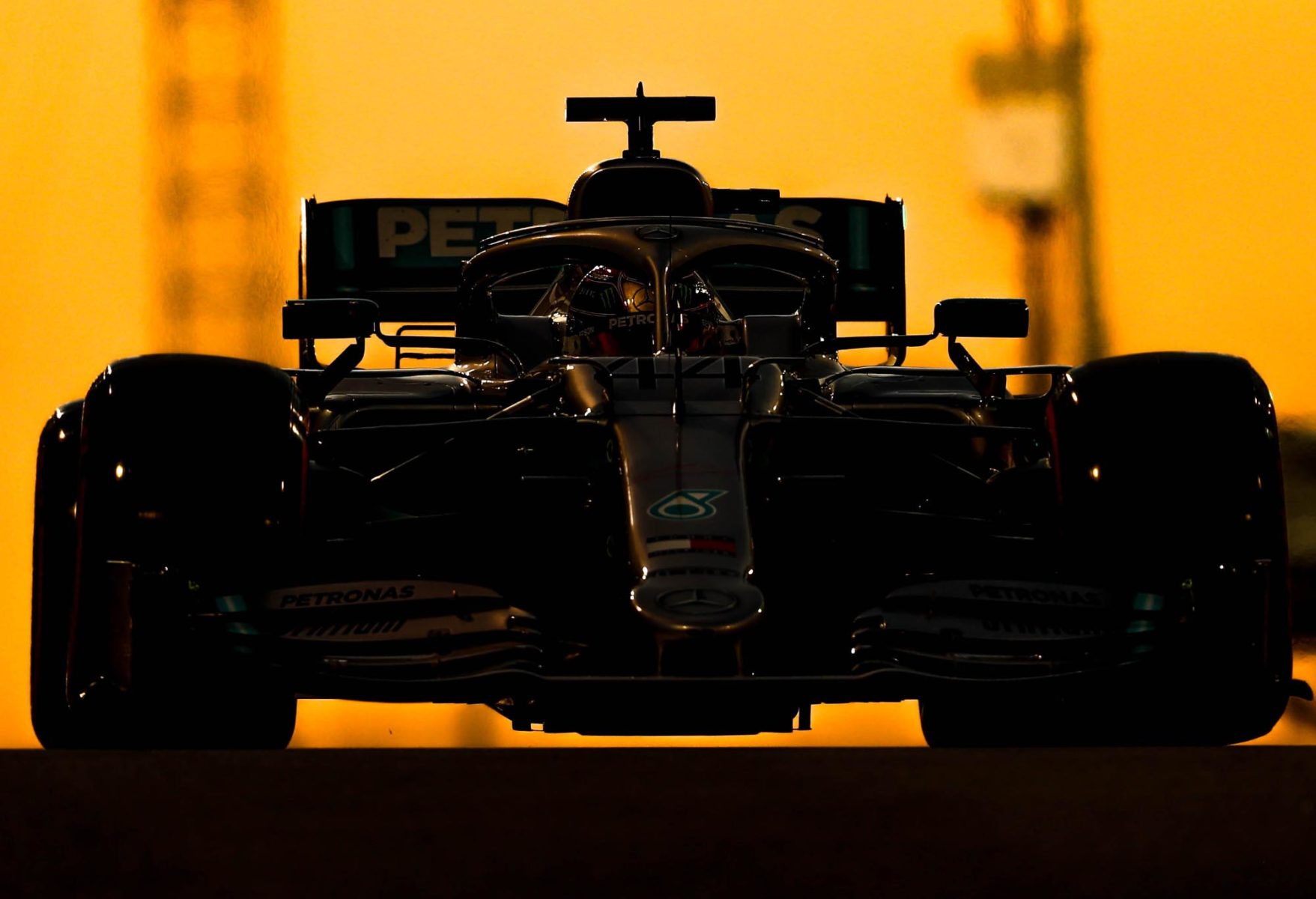Lewis Hamilton on track as the sun sets at the 2019 Abu Dhabi Grand Prix.